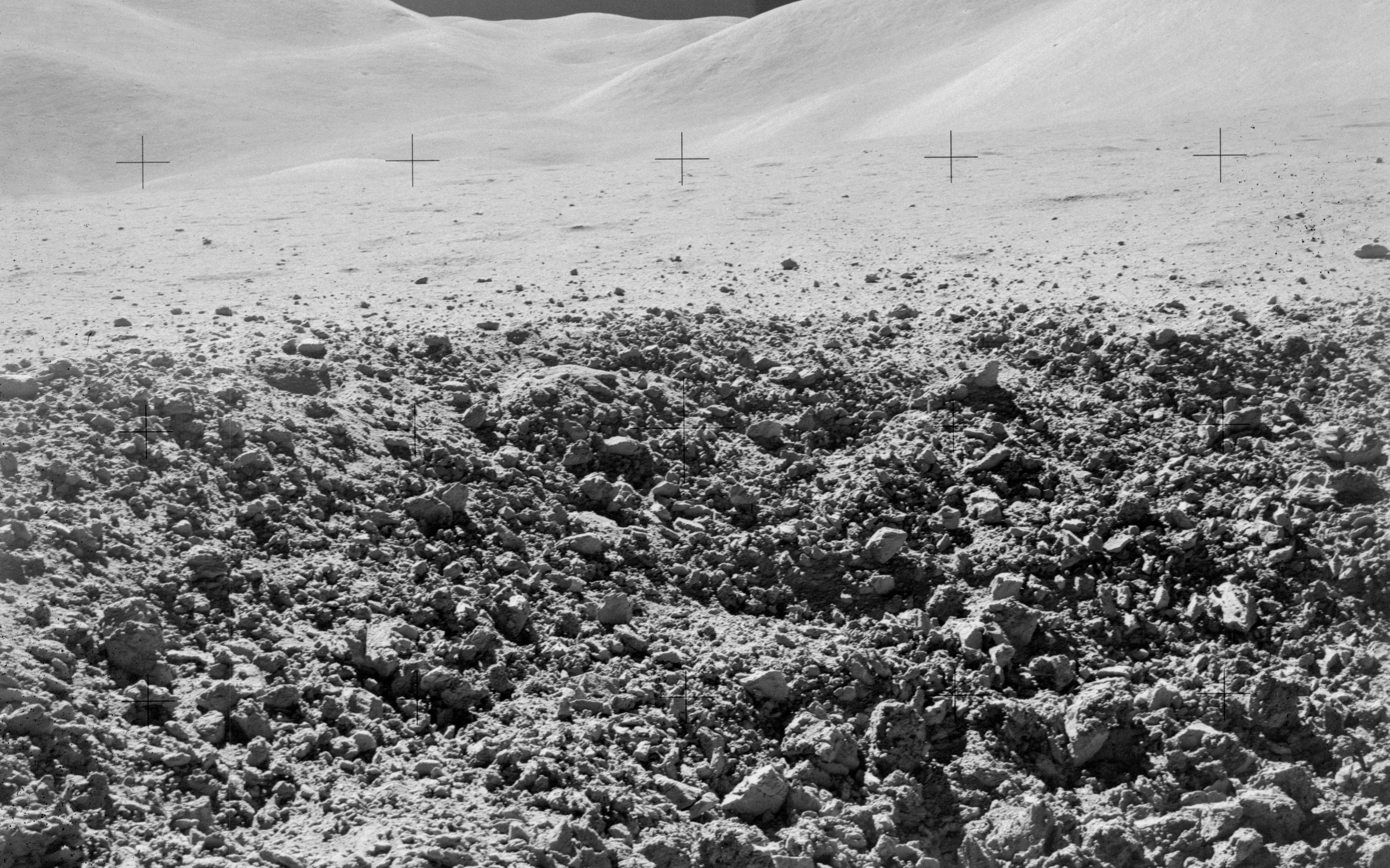 Rocky lunar surface and rolling moon hills photographed during Apollo 15